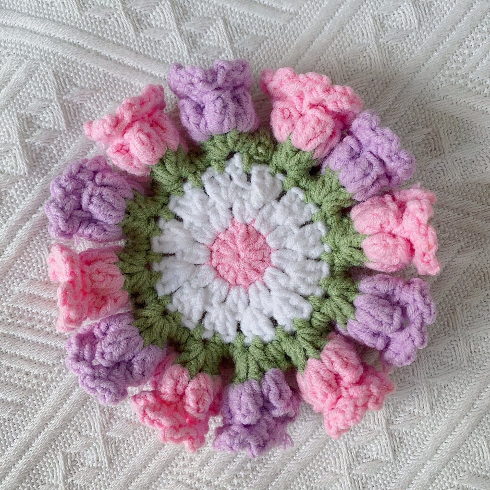 Hand-knitted Bell orchid coaster