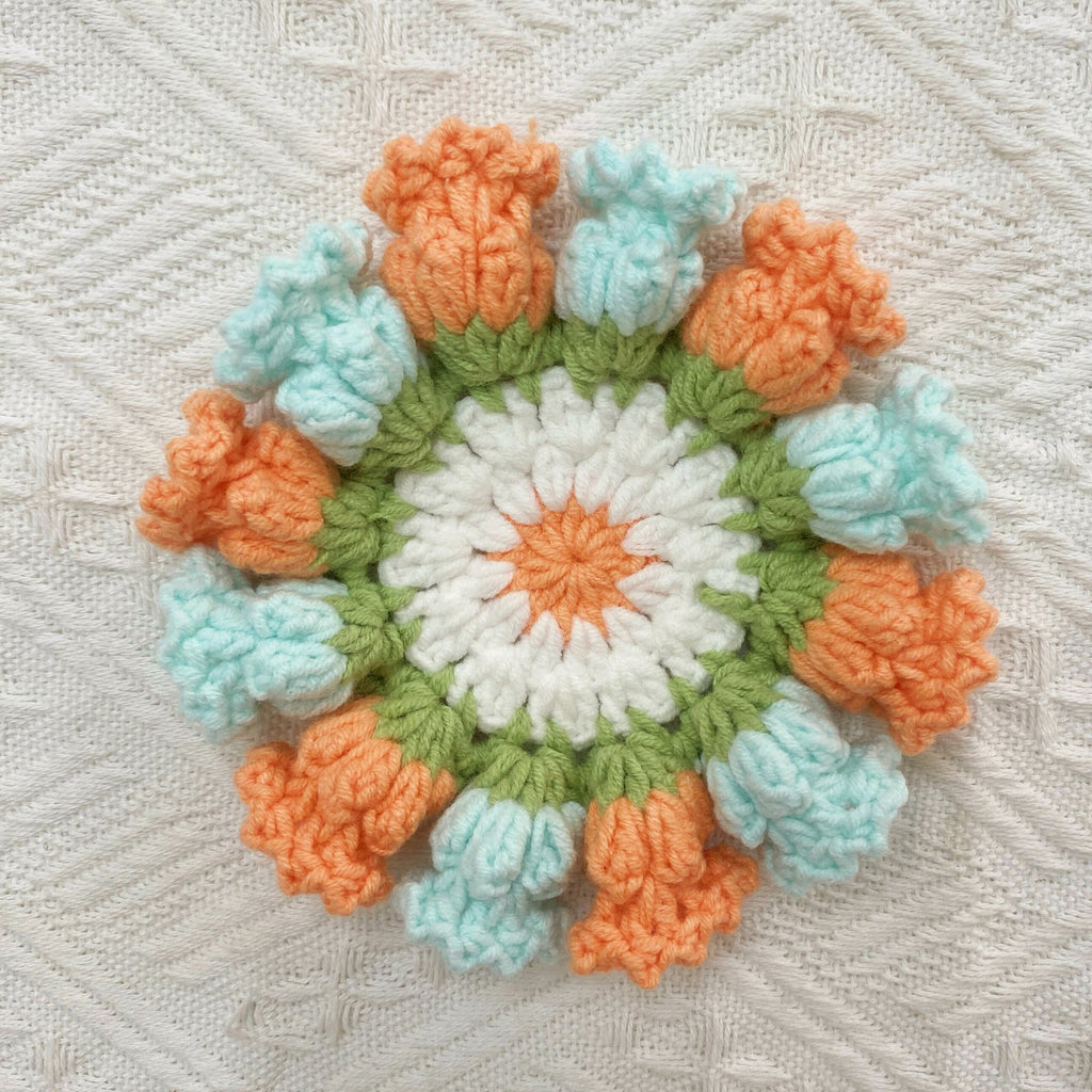 Hand-knitted Bell orchid coaster