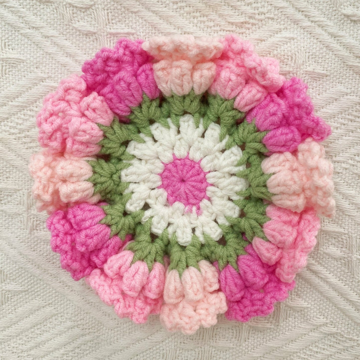 Hand-knitted Bell orchid coaster