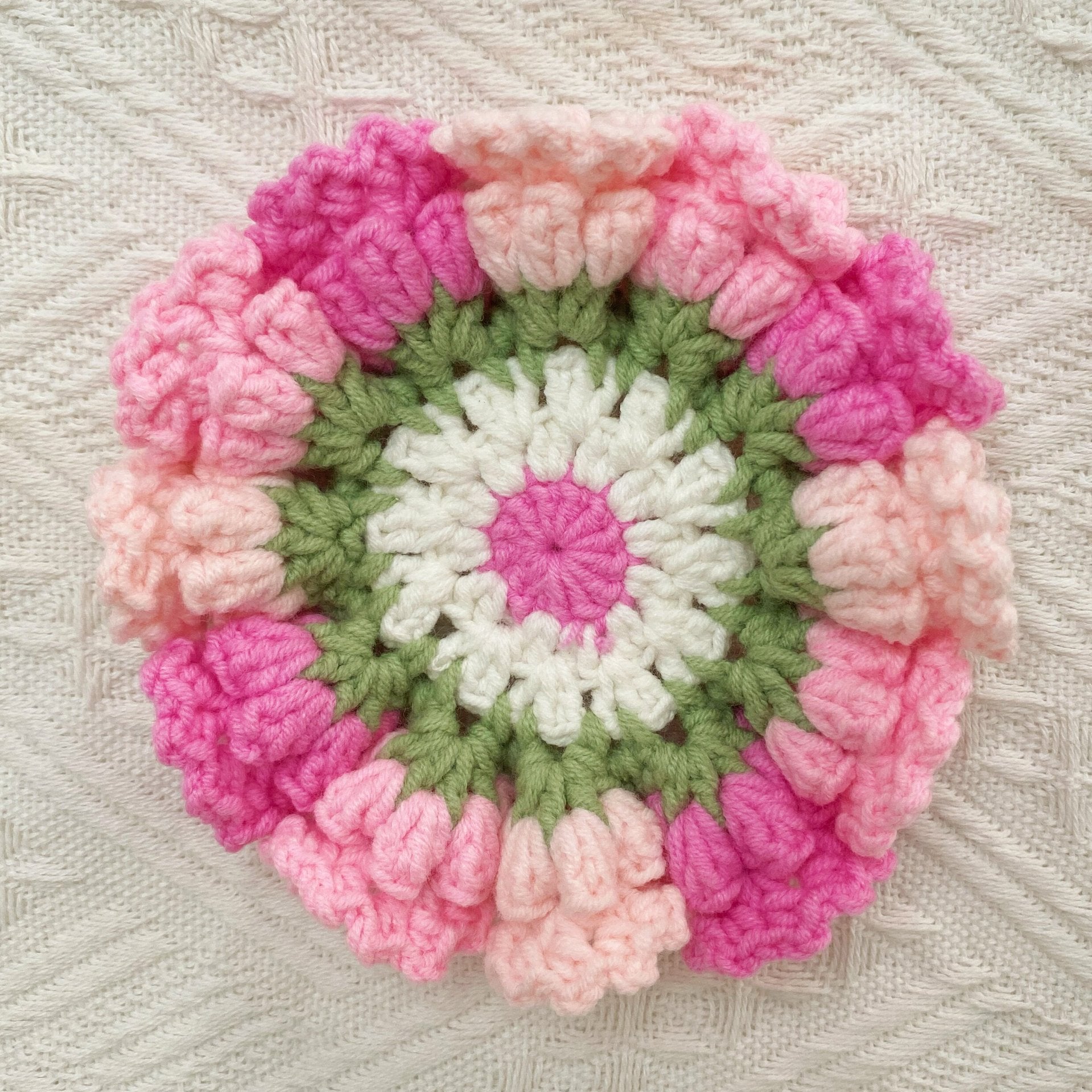 Hand-knitted Bell orchid coaster