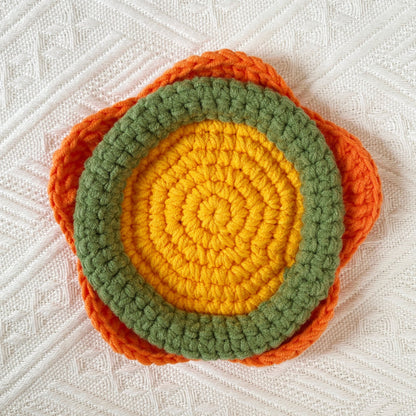 Hand-knitted Bell orchid coaster