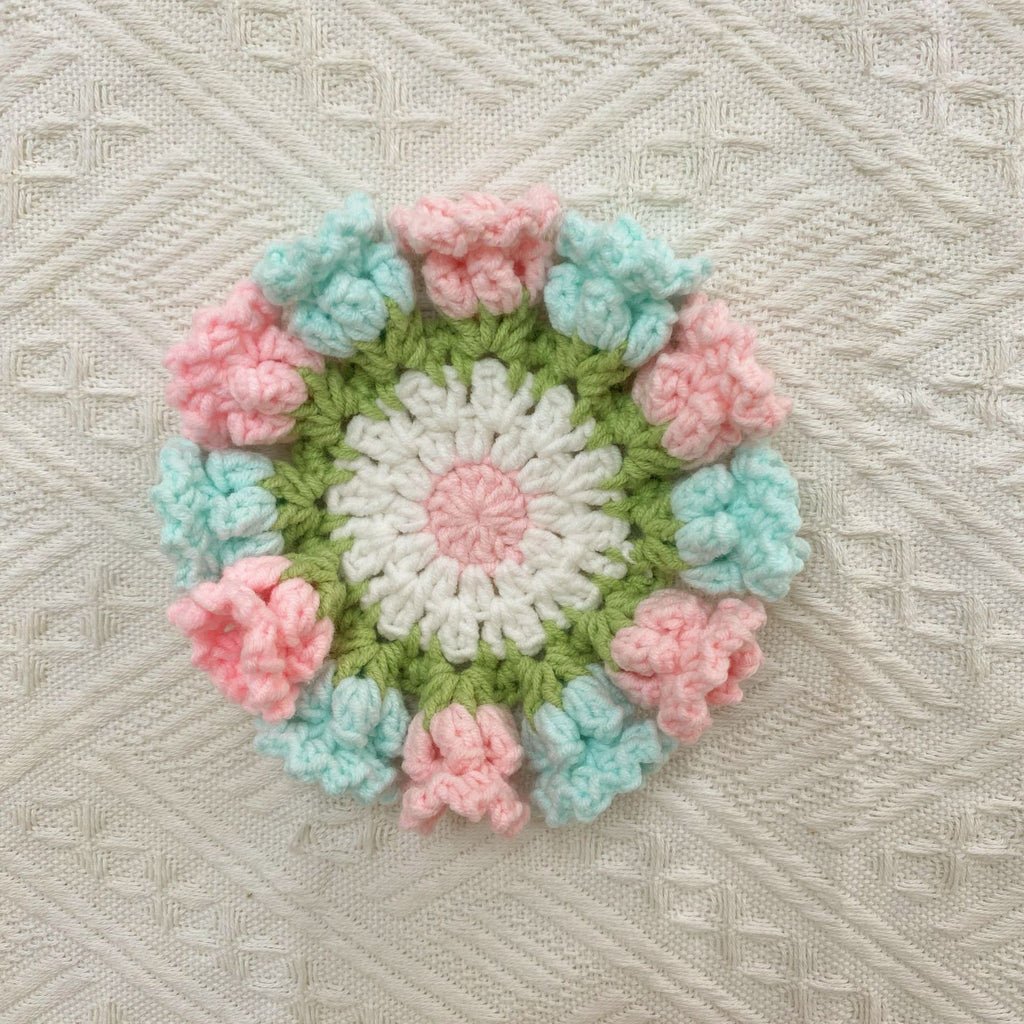 Hand-knitted Bell orchid coaster
