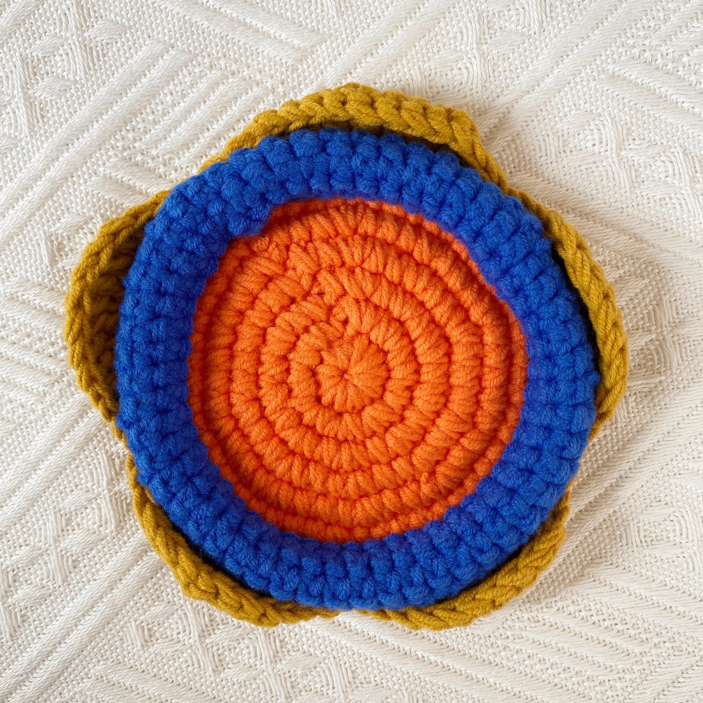 Hand-knitted Bell orchid coaster