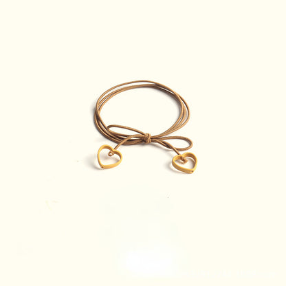 Elastic heart-shaped pendant hair tie